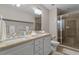Double vanity bathroom with granite countertops and shower at 3201 Environ Way # Bldg 3000, Chapel Hill, NC 27517