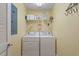 Convenient laundry room with washer, dryer, and shelving at 3201 Environ Way # Bldg 3000, Chapel Hill, NC 27517