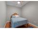 Cozy bedroom with a full bed and ceiling fan at 3201 Environ Way # Bldg 3000, Chapel Hill, NC 27517
