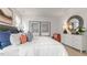 Serene bedroom with a king-size bed, artwork, and a dresser at 723 Dorset Stream Dr, Fuquay Varina, NC 27526