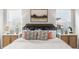 Bright bedroom with a plush bed, stylish lamps, and decorative pillows at 723 Dorset Stream Dr, Fuquay Varina, NC 27526