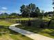 Fenced dog park with grassy area and walkway at 723 Dorset Stream Dr, Fuquay Varina, NC 27526