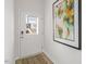 Bright entryway with a white door and modern artwork at 723 Dorset Stream Dr, Fuquay Varina, NC 27526