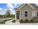 Tan exterior with dark brown door and landscaping at 723 Dorset Stream Dr, Fuquay Varina, NC 27526