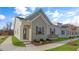 Charming house with gray siding, stone accents, and landscaping at 723 Dorset Stream Dr, Fuquay Varina, NC 27526