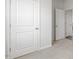 Hallway with white doors and carpeted floors at 723 Dorset Stream Dr, Fuquay Varina, NC 27526