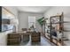 Bright home office with built-in shelving and a large desk at 723 Dorset Stream Dr, Fuquay Varina, NC 27526