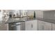 Modern kitchen with granite countertops and stainless steel dishwasher at 723 Dorset Stream Dr, Fuquay Varina, NC 27526