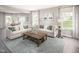 Open living room with sectional sofa and large windows at 8916 Stratus St, Willow Springs, NC 27592