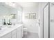 Double vanity bathroom with frameless shower at 8916 Stratus St, Willow Springs, NC 27592