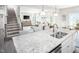 Island kitchen with granite countertops and stainless steel appliances at 8916 Stratus St, Willow Springs, NC 27592