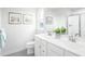 Bathroom with double vanity and gray tile floor at 8916 Stratus St, Willow Springs, NC 27592