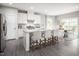 Modern kitchen with island, stainless steel appliances, and hardwood floors at 8916 Stratus St, Willow Springs, NC 27592