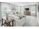 Spacious living room featuring neutral decor and ample natural light at 8916 Stratus St, Willow Springs, NC 27592