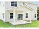 Covered patio with columns, concrete flooring and sliding glass doors at 8916 Stratus St, Willow Springs, NC 27592
