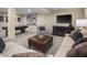 Finished basement boasts a spacious Gathering room with comfortable seating and a media console at 8813 Tartan Clan Dr, Willow Springs, NC 27592