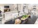 Open concept dining area with black table and white chairs at 8813 Tartan Clan Dr, Willow Springs, NC 27592
