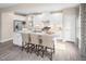 Modern kitchen with white cabinets, granite countertops and island at 8813 Tartan Clan Dr, Willow Springs, NC 27592