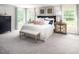 Bright main bedroom with king-size bed and en-suite bathroom at 8813 Tartan Clan Dr, Willow Springs, NC 27592