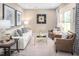 Cozy sitting room with two armchairs and a coffee table at 8813 Tartan Clan Dr, Willow Springs, NC 27592