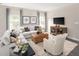 Relaxing living room with sectional sofa and a large TV at 8813 Tartan Clan Dr, Willow Springs, NC 27592