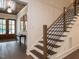 Modern staircase with dark wood treads and metal railing at 119 Sanderway Dr, Chapel Hill, NC 27516