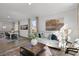 Open living room with white couch and large windows, overlooking backyard at 2232 Cherry Top Dr, Fuquay Varina, NC 27526