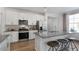 Modern kitchen with stainless steel appliances and a large kitchen island at 2232 Cherry Top Dr, Fuquay Varina, NC 27526