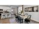 Bright dining room features a white farmhouse table with black chairs at 2232 Cherry Top Dr, Fuquay Varina, NC 27526