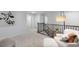 Upper level hallway with comfortable seating area and natural light at 2232 Cherry Top Dr, Fuquay Varina, NC 27526