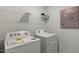 Convenient laundry room with washer, dryer, and overhead shelving at 2232 Cherry Top Dr, Fuquay Varina, NC 27526