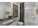 Clean bathroom with tub, single vanity, and neutral color scheme at 2232 Cherry Top Dr, Fuquay Varina, NC 27526