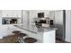 Modern kitchen featuring a large island with seating and stainless steel appliances at 2232 Cherry Top Dr, Fuquay Varina, NC 27526