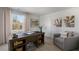 Bright home office featuring a large desk, comfortable chair, and ample natural light at 2232 Cherry Top Dr, Fuquay Varina, NC 27526