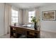 Spacious home office with built-in desk and two large windows at 2232 Cherry Top Dr, Fuquay Varina, NC 27526