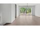 Light-filled dining area with hardwood floors and access to deck at 6408 Tanner Oak Ln, Raleigh, NC 27613