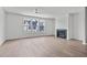 Spacious living room with hardwood floors, fireplace and large windows at 6408 Tanner Oak Ln, Raleigh, NC 27613