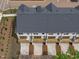 Aerial view of townhomes highlighting rear decks and parking at 6408 Tanner Oak Ln, Raleigh, NC 27613