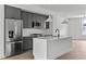 Modern kitchen with stainless steel appliances and white quartz countertops at 6408 Tanner Oak Ln, Raleigh, NC 27613