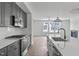 Modern kitchen with stainless steel appliances and white cabinetry at 6408 Tanner Oak Ln, Raleigh, NC 27613