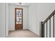 Bright entryway with wood flooring and a charming wooden front door at 6408 Tanner Oak Ln, Raleigh, NC 27613