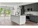 Modern kitchen with stainless steel appliances and a large island at 6408 Tanner Oak Ln, Raleigh, NC 27613