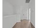 Bright hallway with wood floors and access to other rooms at 6408 Tanner Oak Ln, Raleigh, NC 27613