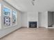 Bright living room with hardwood floors, fireplace and ceiling fan at 6408 Tanner Oak Ln, Raleigh, NC 27613