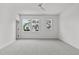 Spacious bedroom with neutral carpeting and ample natural light at 6408 Tanner Oak Ln, Raleigh, NC 27613