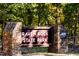 Stone entrance sign for Raven Rock State Park, nestled in a lush forest setting at 130 Charlie Cir, Angier, NC 27501