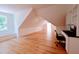 Versatile bonus room with hardwood floors, built-in shelving and a workspace at 5200 Blue Stem Ct, Raleigh, NC 27606