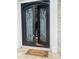 Ornate double front doors with sidelights and a welcome mat at 5200 Blue Stem Ct, Raleigh, NC 27606