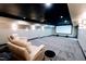 Home theater with large screen, comfortable seating, and ambient lighting at 5200 Blue Stem Ct, Raleigh, NC 27606