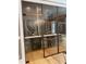Modern wine cellar with glass doors and ample storage at 5200 Blue Stem Ct, Raleigh, NC 27606
